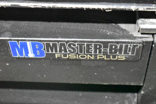 Master-Bilt MBGRP74-HG logo detail on black metal surface, marked "FUSION PLUS."