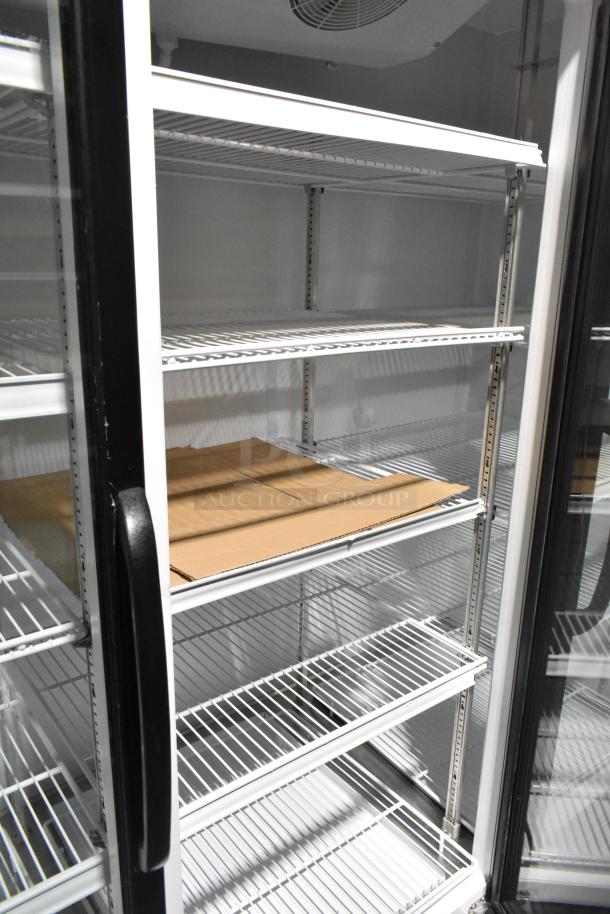Master-Bilt MBGRP74-HG 3-door cooler with poly-coated racks, metal construction. 115/208-240V, 1 phase.