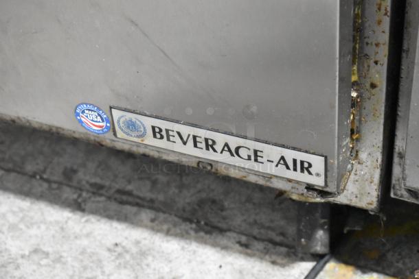 Beverage Air SPE48-18M-HMP stainless steel prep table, Made in USA label, on commercial casters, showing slight wear.