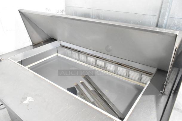 Beverage Air SPE48-18M-HMP stainless steel sandwich prep table, commercial casters, 115V, open lid, clean condition.