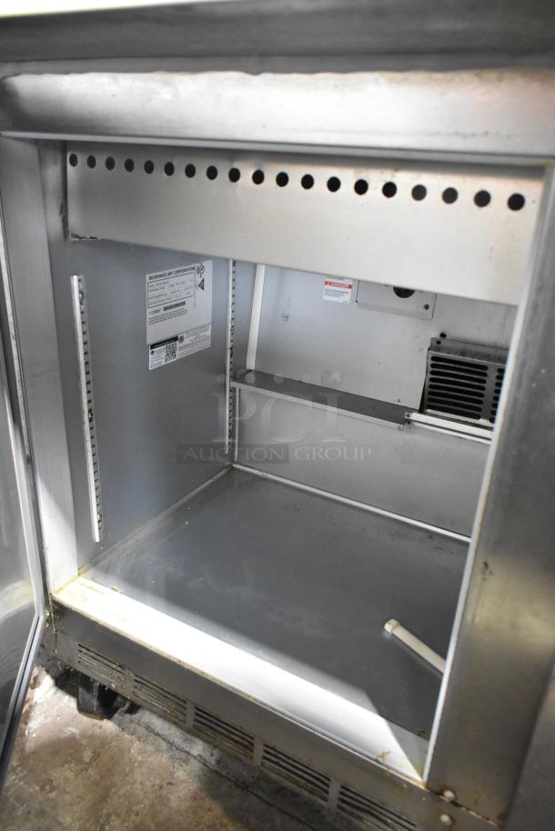 Beverage Air SPE48-18M-HMP stainless steel prep table interior, showing labels and shelving brackets. 115 volts, 1 phase.