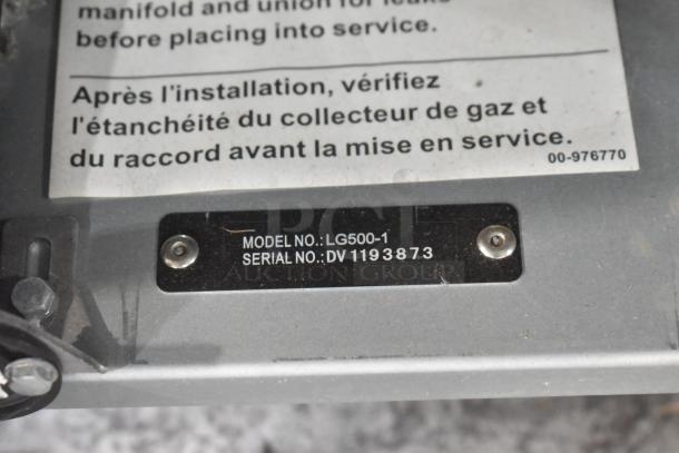 "Vulcan LG500-1 stainless steel deep fryer tag, model LG500-1, serial DV1193873, indicating brand and model."