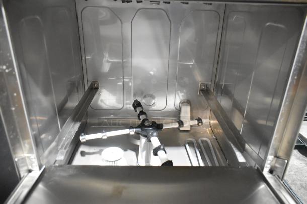 Noble 495HTGW22 stainless steel undercounter dishwasher, scratch and dent, new condition. Interior view showing spray arms.