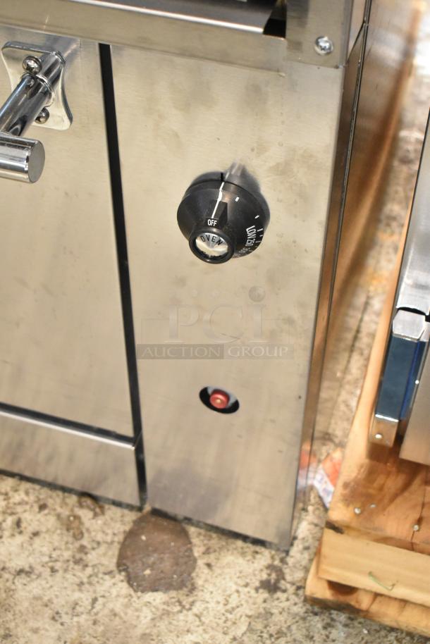 Wolf C36S-6BP stainless steel commercial propane range control panel, features oven dial. New with minor dents.