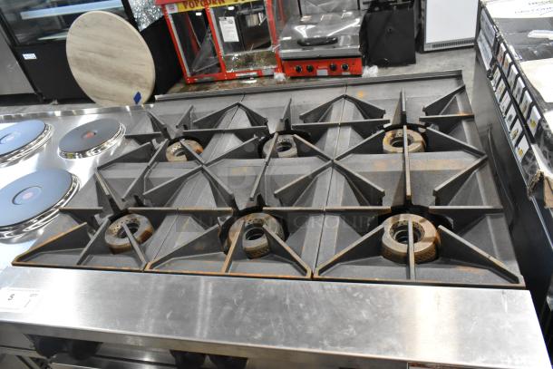 Brand new Wolf C36S-6BP stainless steel commercial propane gas 6-burner range with oven, minor scratches and dents.