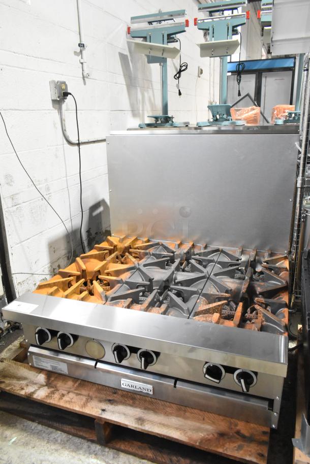 New Garland G36-6T commercial range, 6 burners, stainless steel, 36", natural gas, 198,000 BTU, scratch and dent condition.
