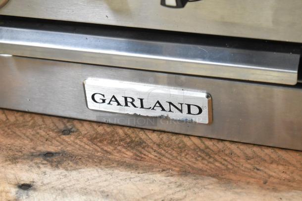 Brand new Garland G36-6T stainless steel commercial 6-burner range. Scratch and dent. 36" modular, 198,000 BTU, gas.