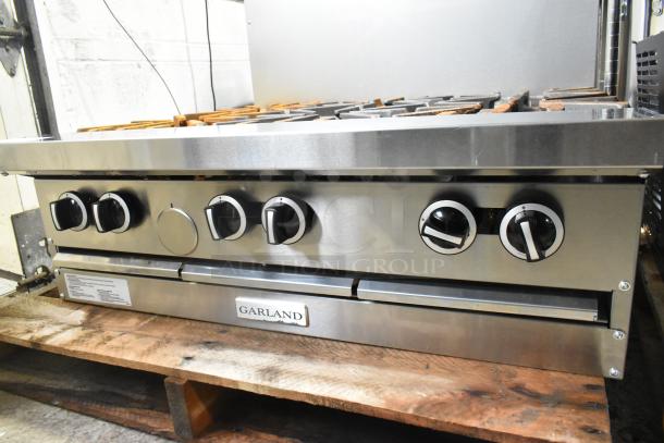 Brand new Garland G36-6T commercial stainless steel 6-burner range, 36" modular top, natural gas, 198,000 BTU. Scratch and dent.