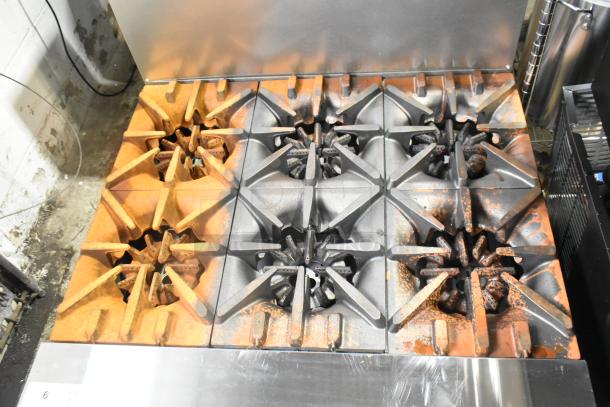 Brand new Garland G36-6T stainless steel 6-burner range, 36" modular top, natural gas, minor scratches, 198,000 BTU.