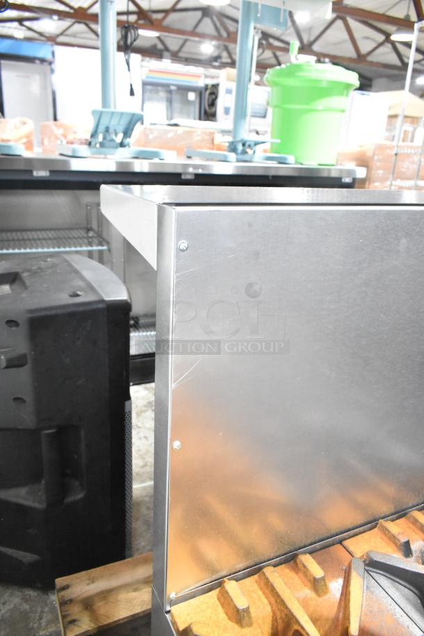 Brand new Garland G36-6T stainless steel 36" range, 6 burners, countertop natural gas, 198,000 BTU, with minor scratches.