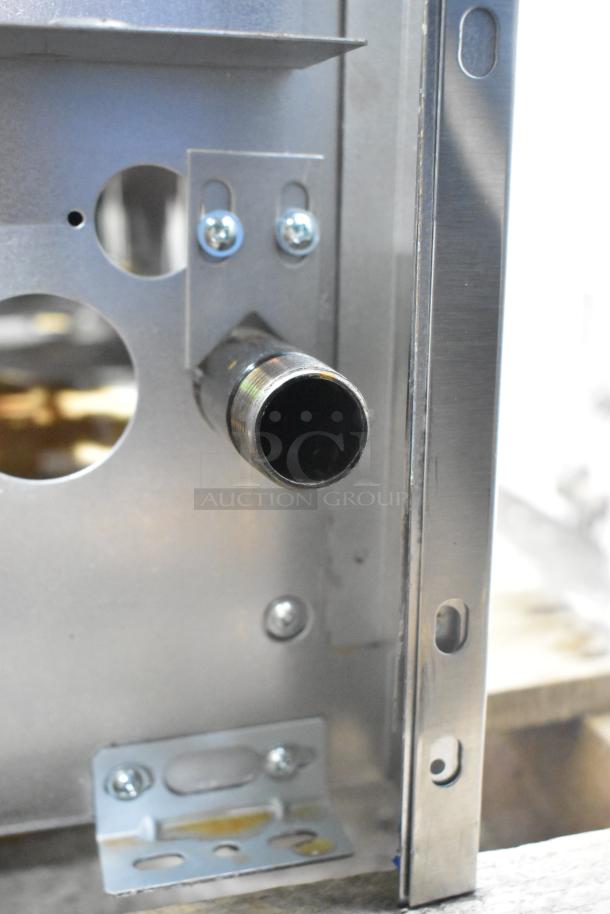 Alt text: Close-up of a Garland G36-6T stainless steel commercial range component. New condition with visible mounting holes.