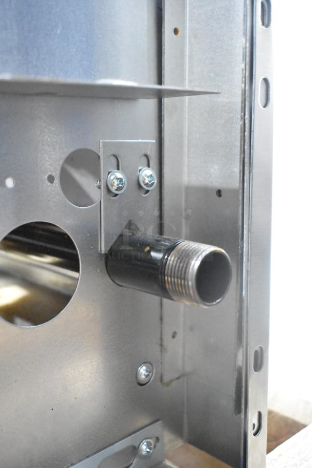 Close-up of Garland G36-6T range's internal component. Features visible metallic parts and connection fittings.