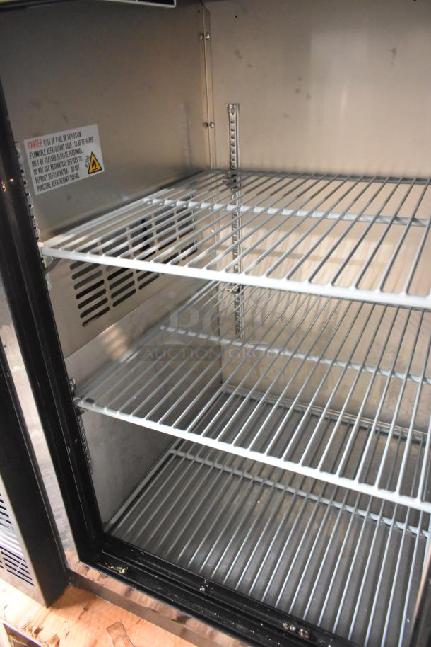 BRAND NEW Avantco 178UBB72SHC metal commercial refrigerator, 73", black, LED lighting, 115 Volts, visible interior shelves.