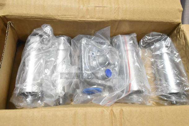 Box containing components for the Cooking Performance Group 48" natural gas commercial griddle, new and wrapped in plastic.