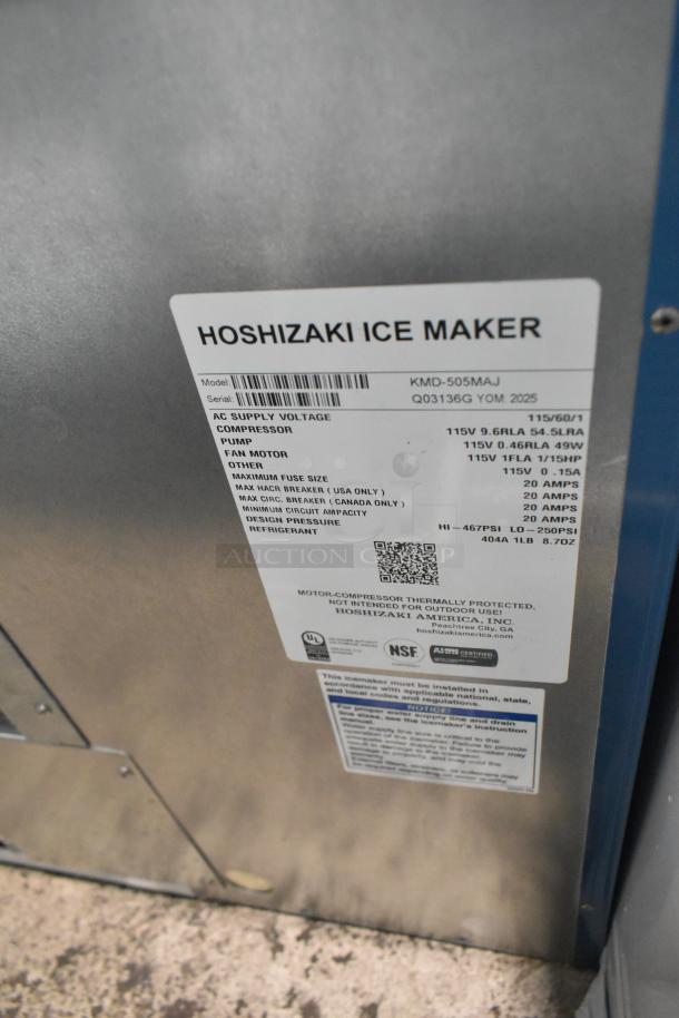 Brand new Hoshizaki KMD-505MAJ stainless steel ice machine. 500 lb capacity, 115V, 1 phase. Label indicates model and specs.
