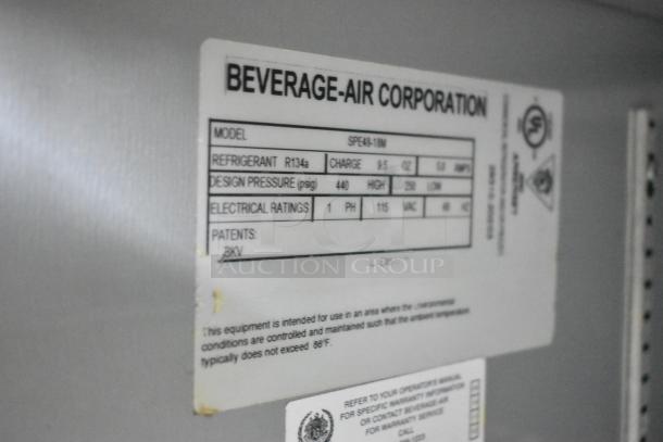Stainless steel Beverage Air SPE48-18M commercial sandwich salad prep table on casters, 115V, 1 phase, R134a refrigerant.