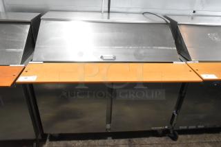 Beverage Air SPE48-18M stainless steel prep table, two-section, orange top, commercial casters, used condition.