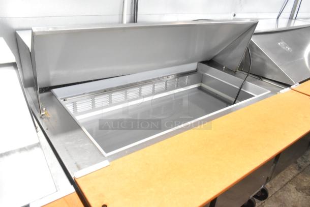 Beverage Air SPE48-18M stainless steel sandwich prep table with bain marie and commercial casters, 115V, 1 Phase.
