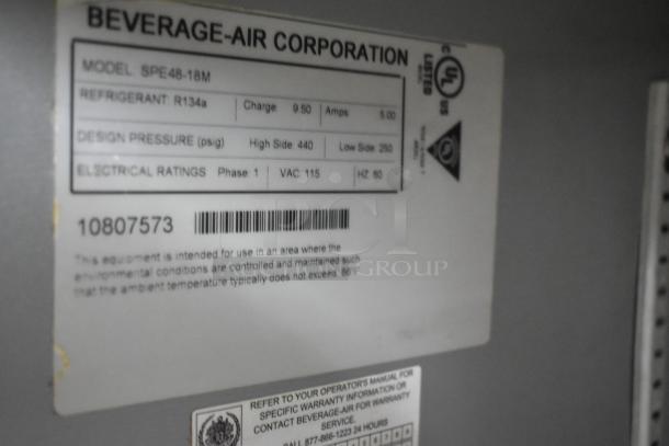 Beverage Air SPE48-18M stainless steel commercial prep table. Features 115V, 1 phase. UL listed. Tag shows specs and model.