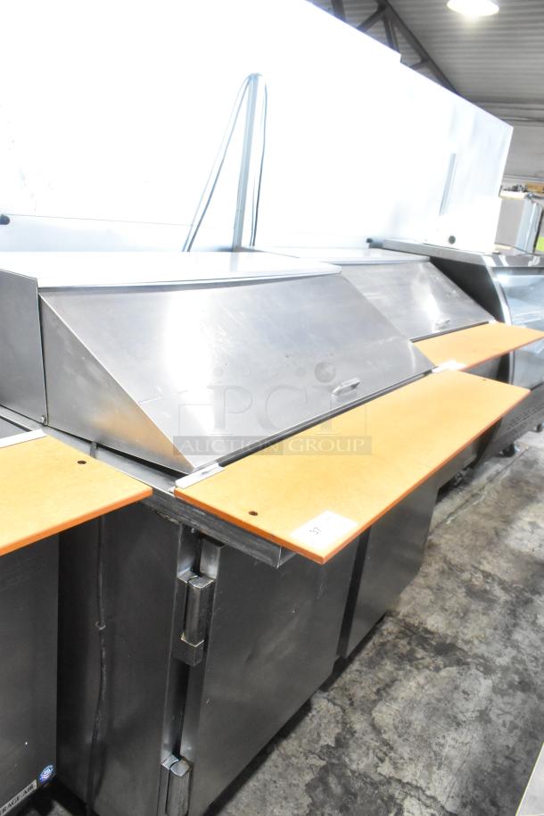 Beverage Air SPE48-18M stainless steel sandwich prep table with casters, commercial grade, good condition, 115V.