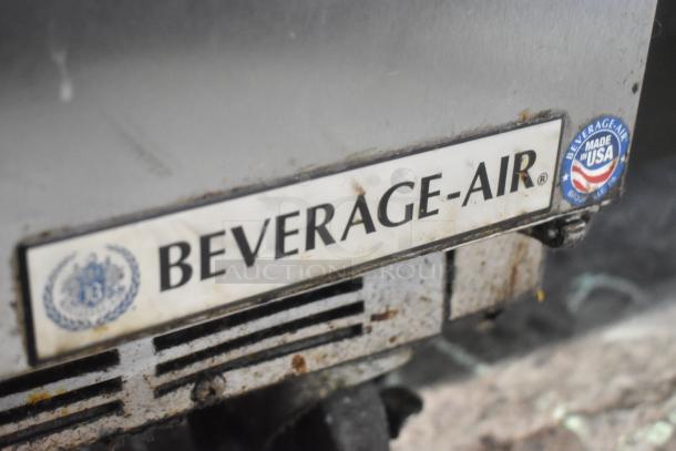 Beverage Air SPE48-18M-HMP stainless steel sandwich salad prep table, 115V, on commercial casters, shows label and USA badge.