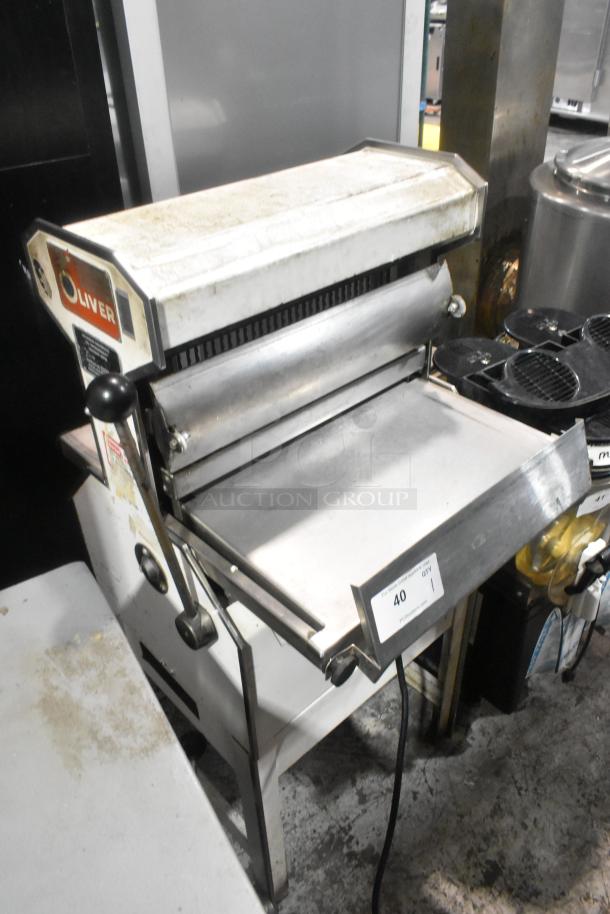 Oliver 777 metal commercial bread loaf slicer, 115V, 1 phase. Visible wear, Oliver branding on the side, large slicer tray.