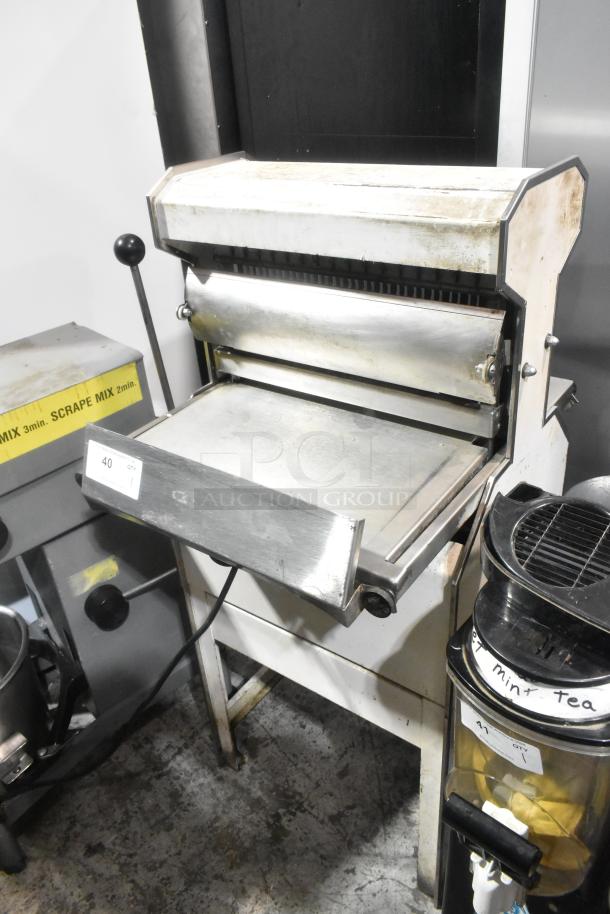 Oliver 777 Metal Commercial Bread Loaf Slicer in used condition. 115 Volts, 1 Phase. Durable floor model design.