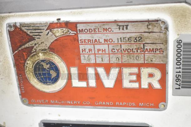 Oliver 777 Metal Commercial Bread Loaf Slicer, model 777, 115V, 1 phase. The label shows model and serial number.