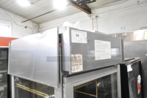 Hatco RFST-1K heated holding cabinet with metal exterior, commercial casters, 120 volts, 1 phase. Visible label on top.