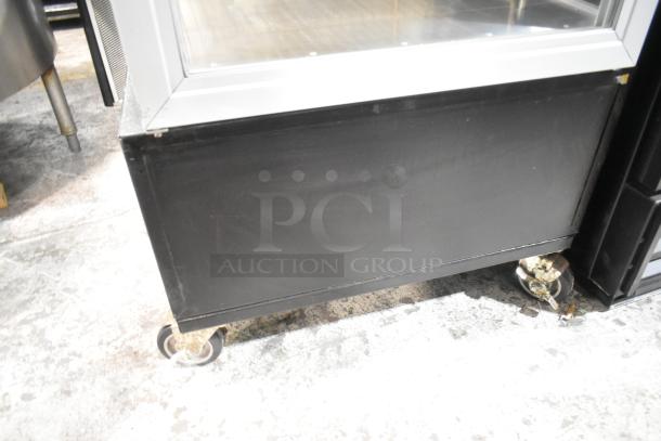 Hatco RFST-1K heated holding cabinet on commercial casters. Metal exterior, 120 volts, 1 phase, for merchandising use.