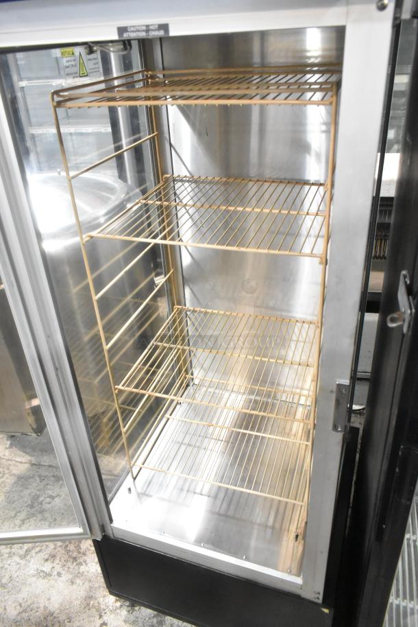 Hatco RFST-1K metal heated holding cabinet, 120 volts, with shelves and casters. Ideal for commercial use.