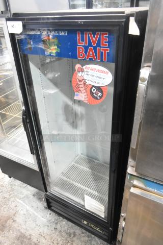 True GDM-12 metal commercial single-door cooler with glass front, poly-coated racks, and live bait signage. 115 volts, 1 phase.