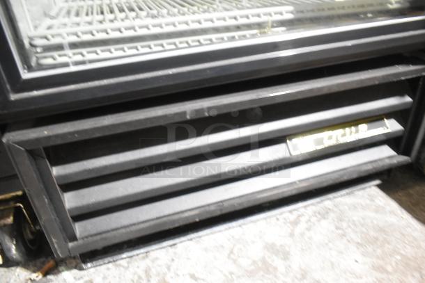 True GDM-12 metal commercial cooler, single door, poly-coated racks, 115 volts, 1 phase. Great condition.
