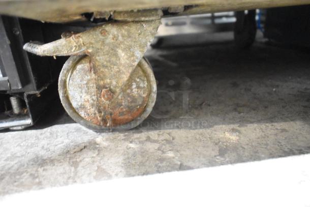 Rusted caster wheel on Alto Shaam 1000-TH-I commercial cook and hold oven, 208-240 volts, 1 phase.