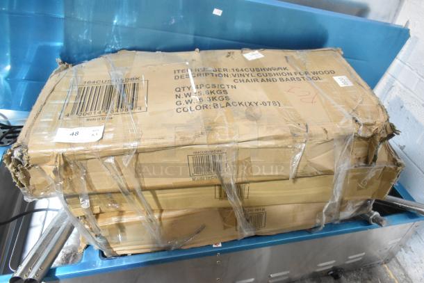 Box of 4 Lancaster Table & Seating 164CUSHWDBK black vinyl seat cushions for wood chairs, new scratch and dent condition.