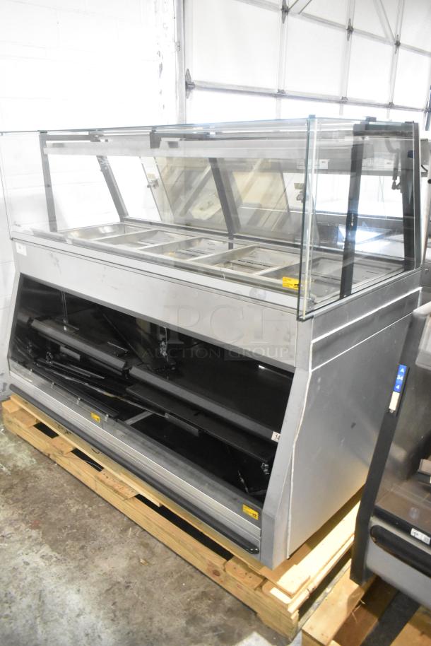 Brand new scratch and dent metal commercial grab and go merchandiser. Open floor style, glass panels, minor surface marks.