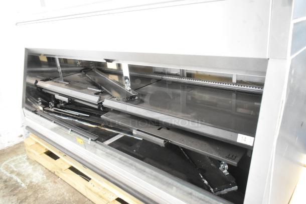 Brand new metal commercial grab-and-go merchandiser, scratch and dent, open floor style, steel shelves visible.