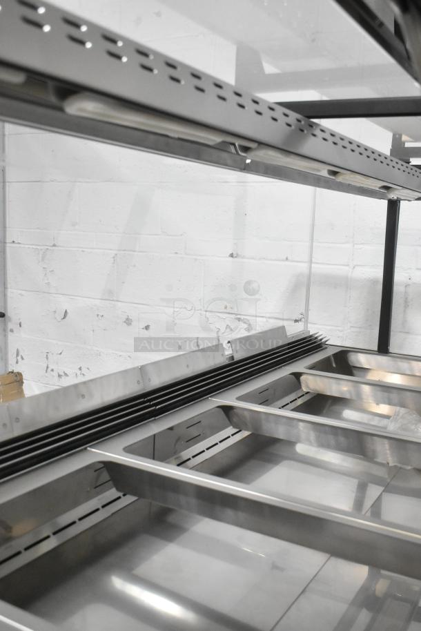 Brand new metal commercial floor style open grab-and-go merchandiser with minor scratches and dents. Ideal for retail.