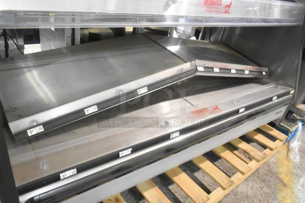 Custom Deli metal open merchandiser, floor style, 120/208V, 1 phase, caution labels visible, on wooden pallet.