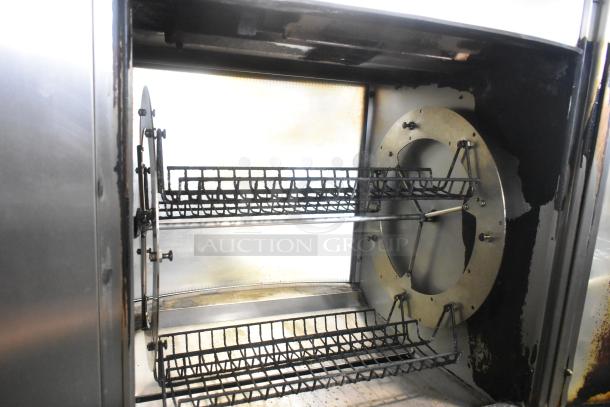 Fri-jado STG7-P stainless steel commercial rotisserie oven, in use, showing interior racks and mechanism, 208V, 1 phase.