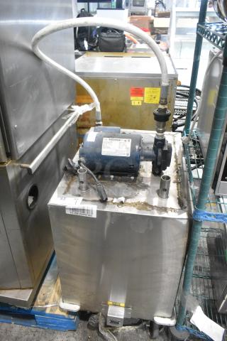 Stainless steel commercial oil filter on casters, features hoses and motor, visible wear. Includes caution labels and barcode.