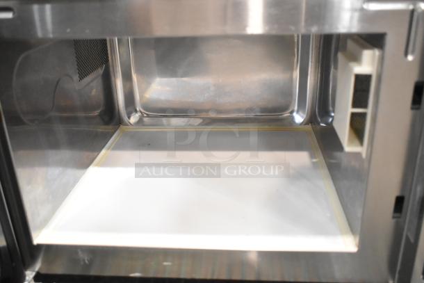 Amana RCS10TS stainless steel commercial countertop microwave oven interior in clean condition, 120 volts, 1 phase.