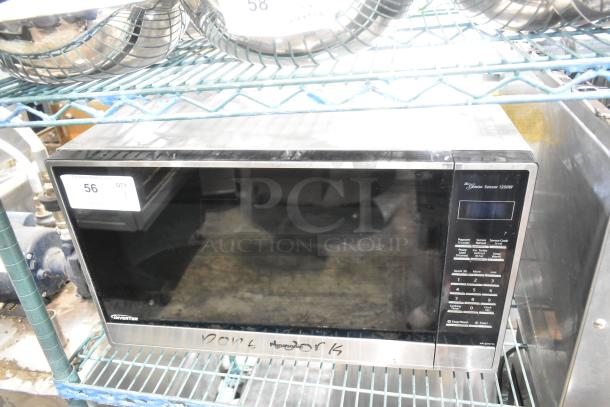 The Genius Stainless Steel Countertop Microwave Oven, 120V, marked "Doesn't Work", on shelving. Model NN-SN751S.