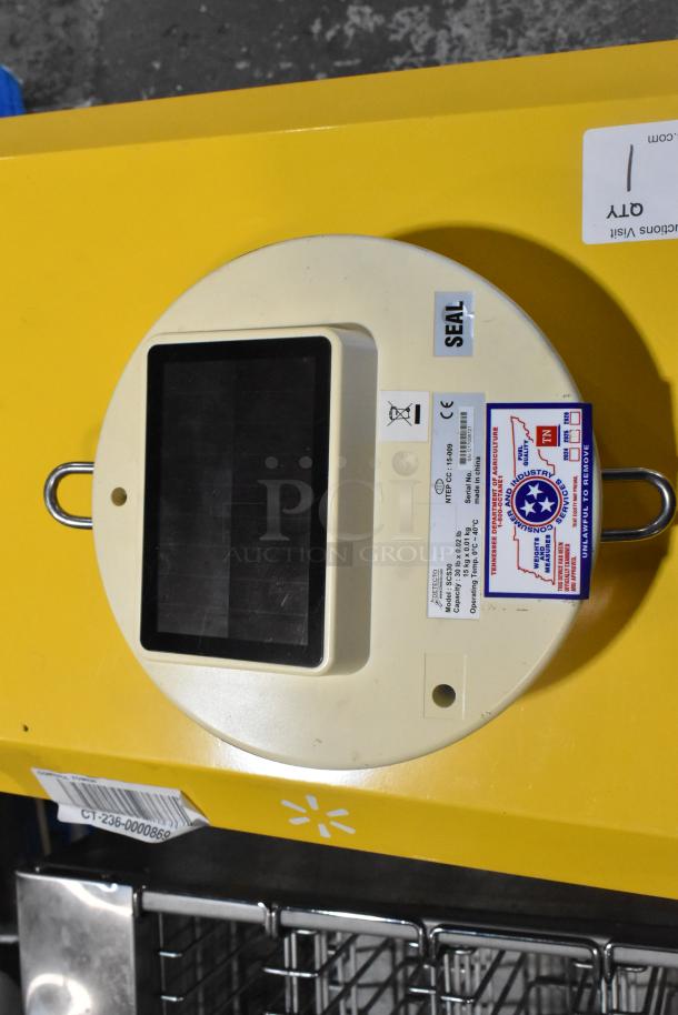 Detecto SCS30 30 lb capacity hanging produce scale, white casing with digital display, visible inspection tags, sealed condition.