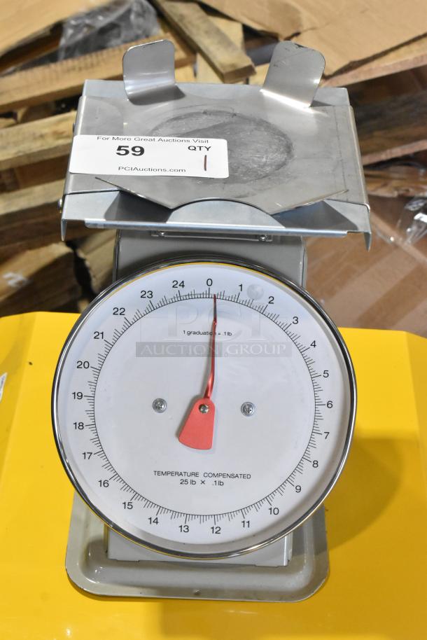 Metal countertop scale with a round dial, red needle, and stainless steel surface. Slight wear visible; marked "Temperature Compensated 25 lb x .1 lb."