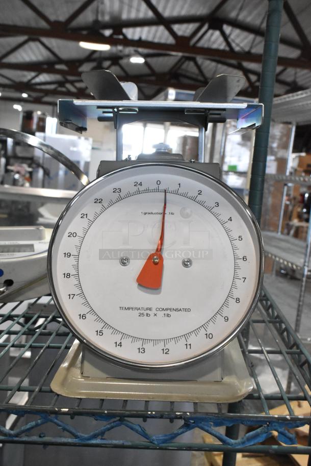 Vintage Metal Countertop Scale, round dial, temperature compensated, measures up to 25 lbs, good condition.