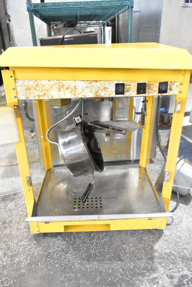 2019 OY-828 commercial popcorn machine in yellow. Includes metal kettle, control panel, 110 volts, 1 phase. Used condition.