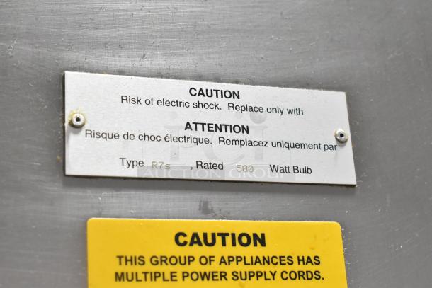 Fri-jado TDR7+7P stainless steel rotisserie oven on casters, electric, 208V, 3 phase. Includes caution and bulb type labels.