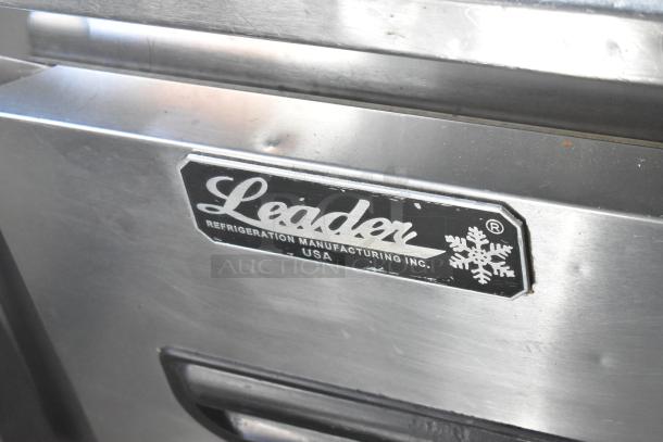 Leader stainless steel commercial 4-drawer undercounter cooler with logo label, on casters. 115 volts, 1 phase.