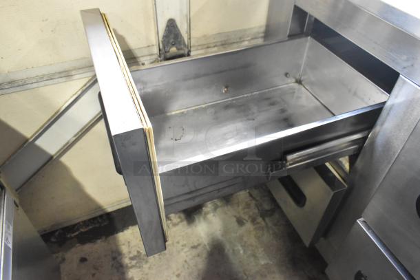 Leader stainless steel 4-drawer undercounter cooler on casters, 115V, 1 phase. Features open drawer, commercial setting.